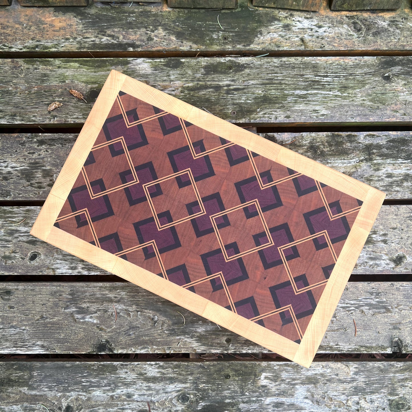 Rectangular mat with geometric pattern on a wooden surface