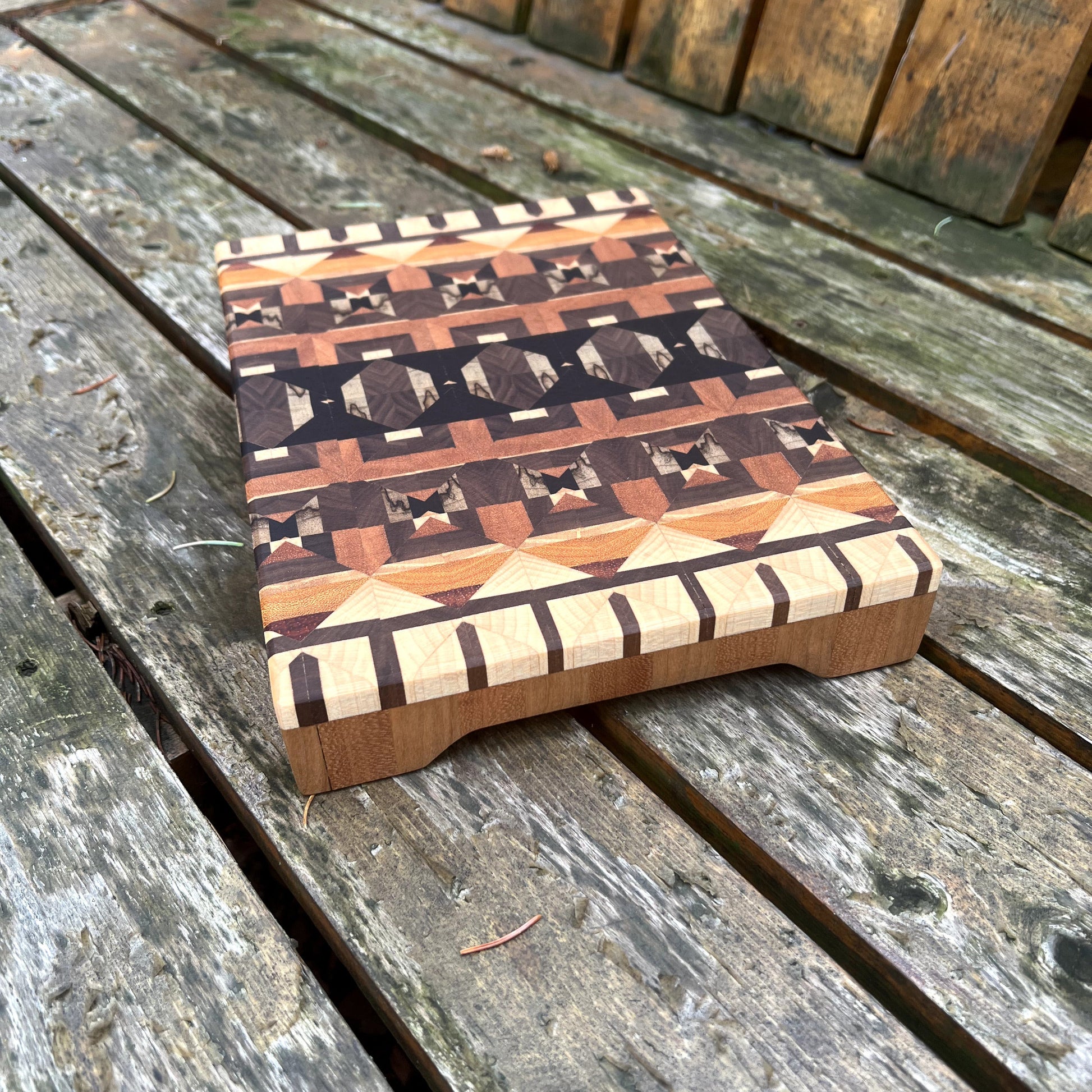 Wooden stool with geometric pattern on a wooden surface