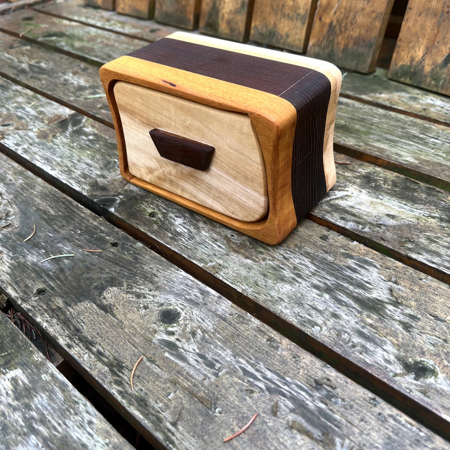 Wooden block with a rectangular cutout on a wooden surface
