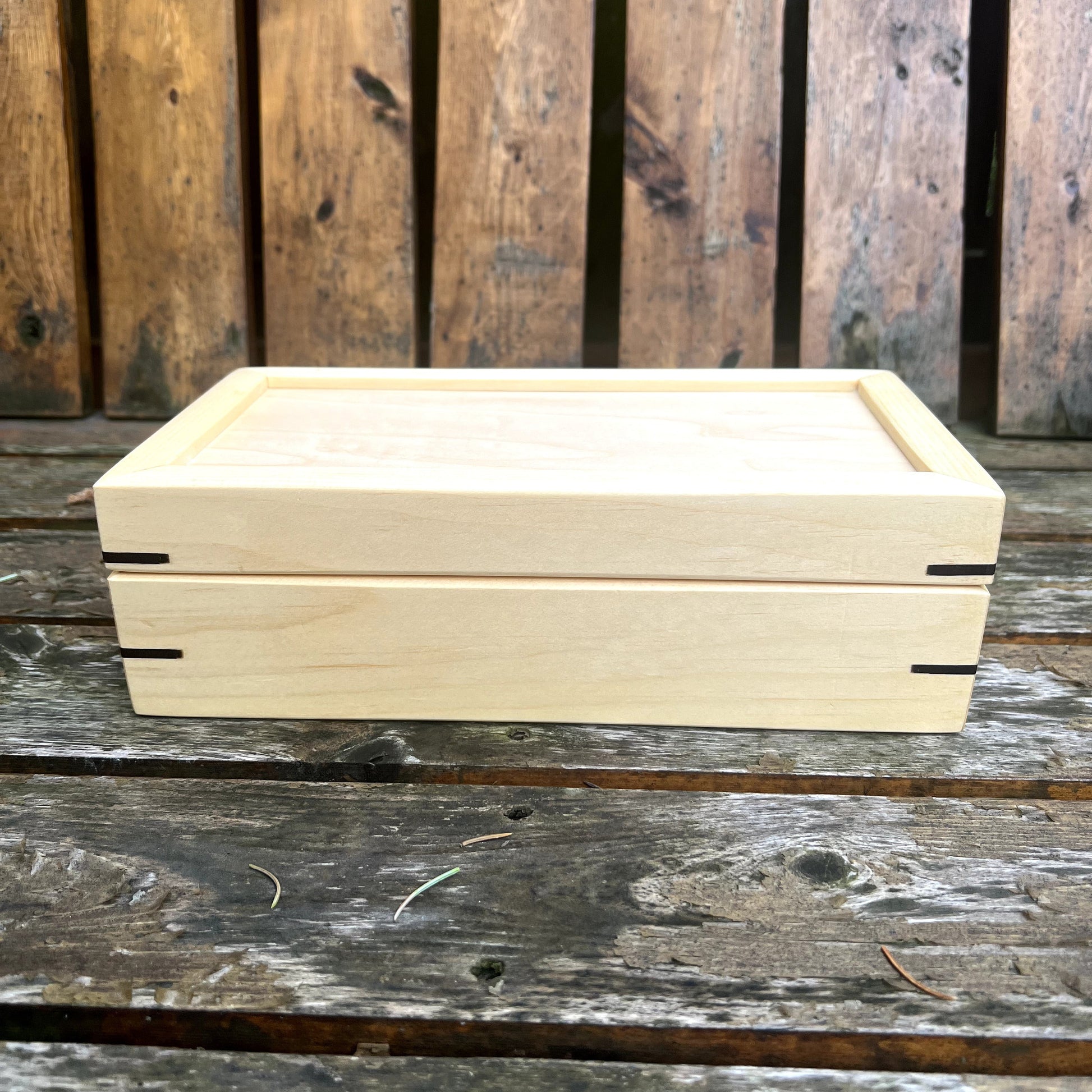Wooden box on a wooden surface with a rustic background