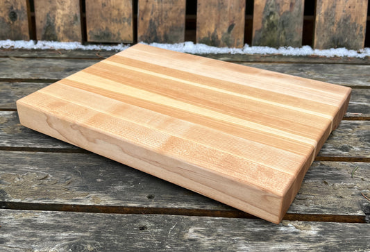 Wooden cutting board on a wooden surface with a rustic background