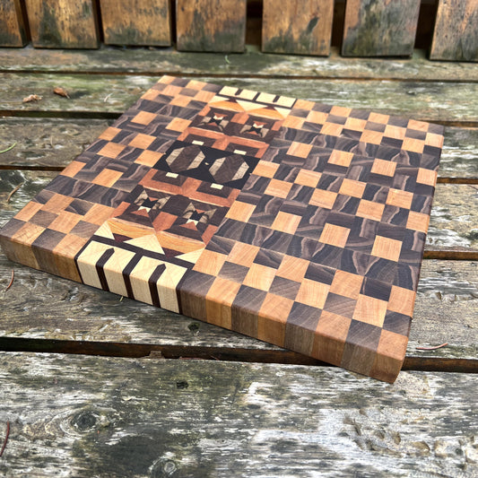 Wooden cutting board with checkered pattern on a wooden surface