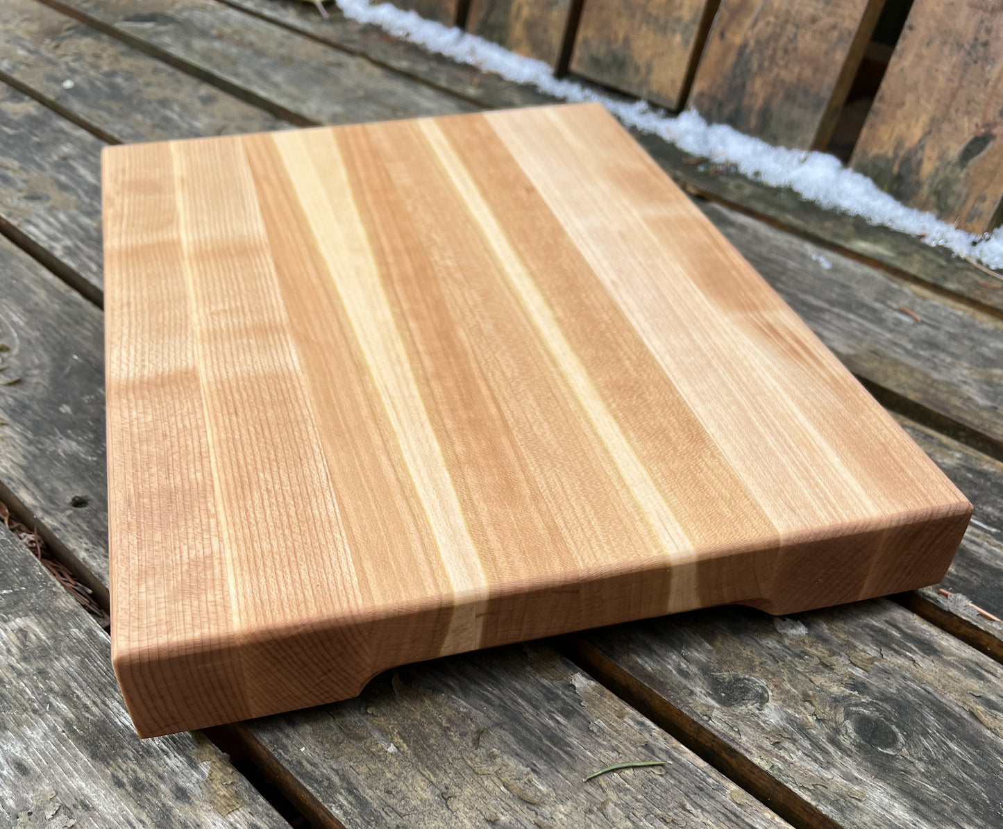 Wooden cutting board on a wooden surface