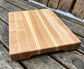 Wooden cutting board on a wooden surface