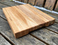 “Close-up of handcrafted maple and cherry grain on The Nordic cutting board.”