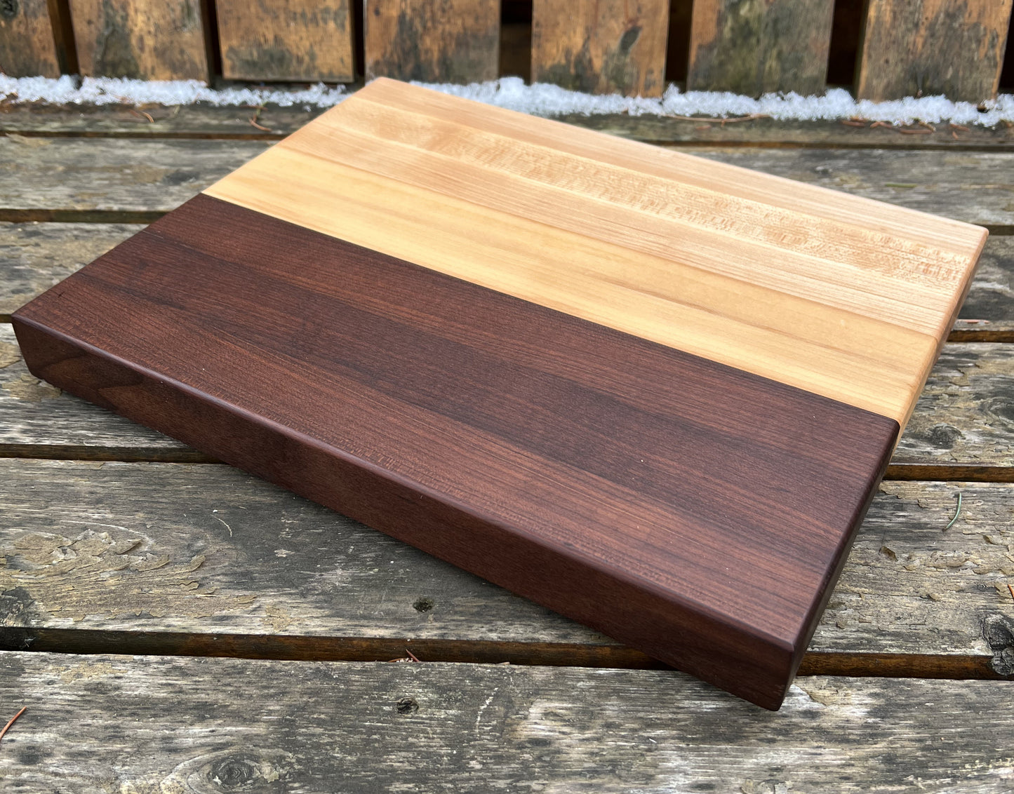 “Close-up of roasted maple, cherry, and maple grain on The Reykjavík split-tone cutting board.”